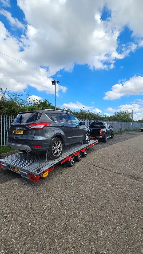 Nick Recovery flatbed truck helping a broken down car near Rugby School on the A45
