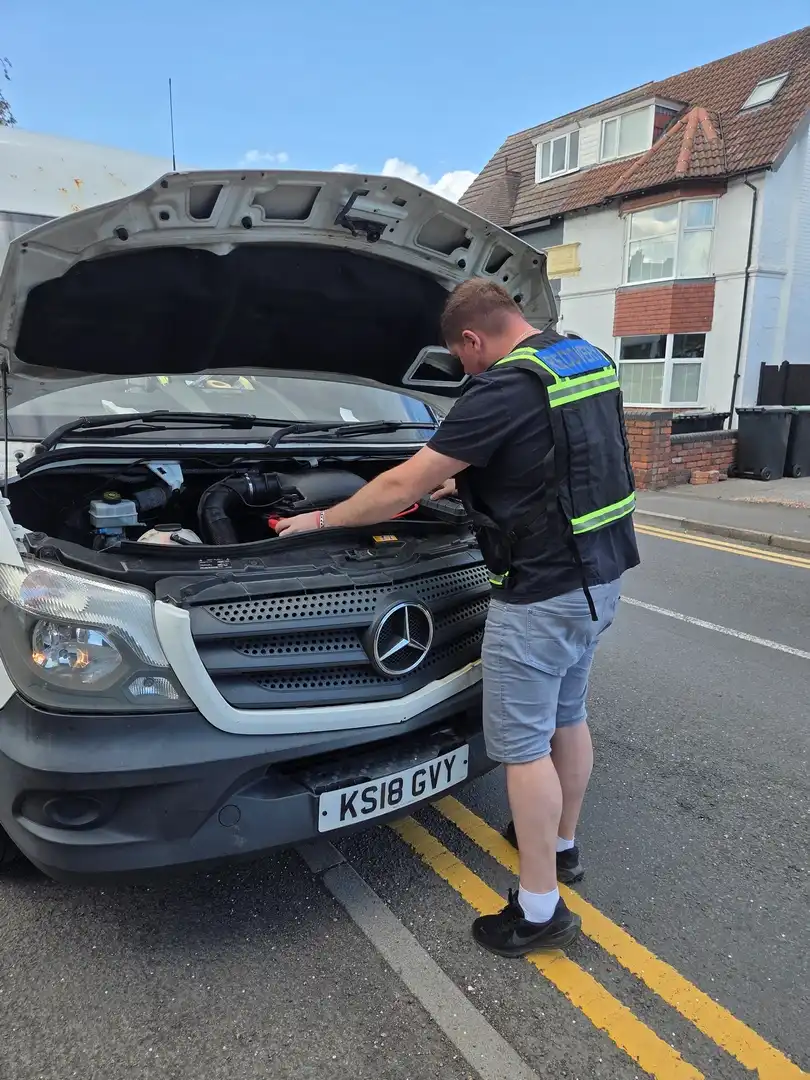 van recovery Corby commercial vehicle being loaded onto recovery truck